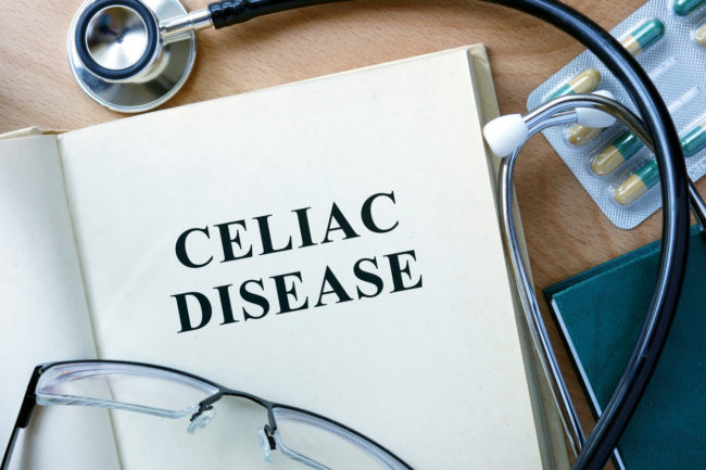 Celiac Disease concept. Book with stethoscope and pills.