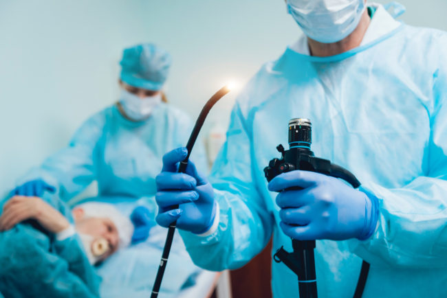 doctor with instruments for colonoscopy