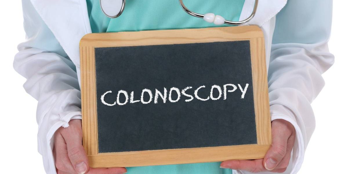 doctor holding small chalkboard with the word "colonoscopy"