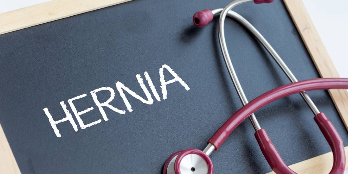 the word "Hernia" written on a board next to stethoscope.