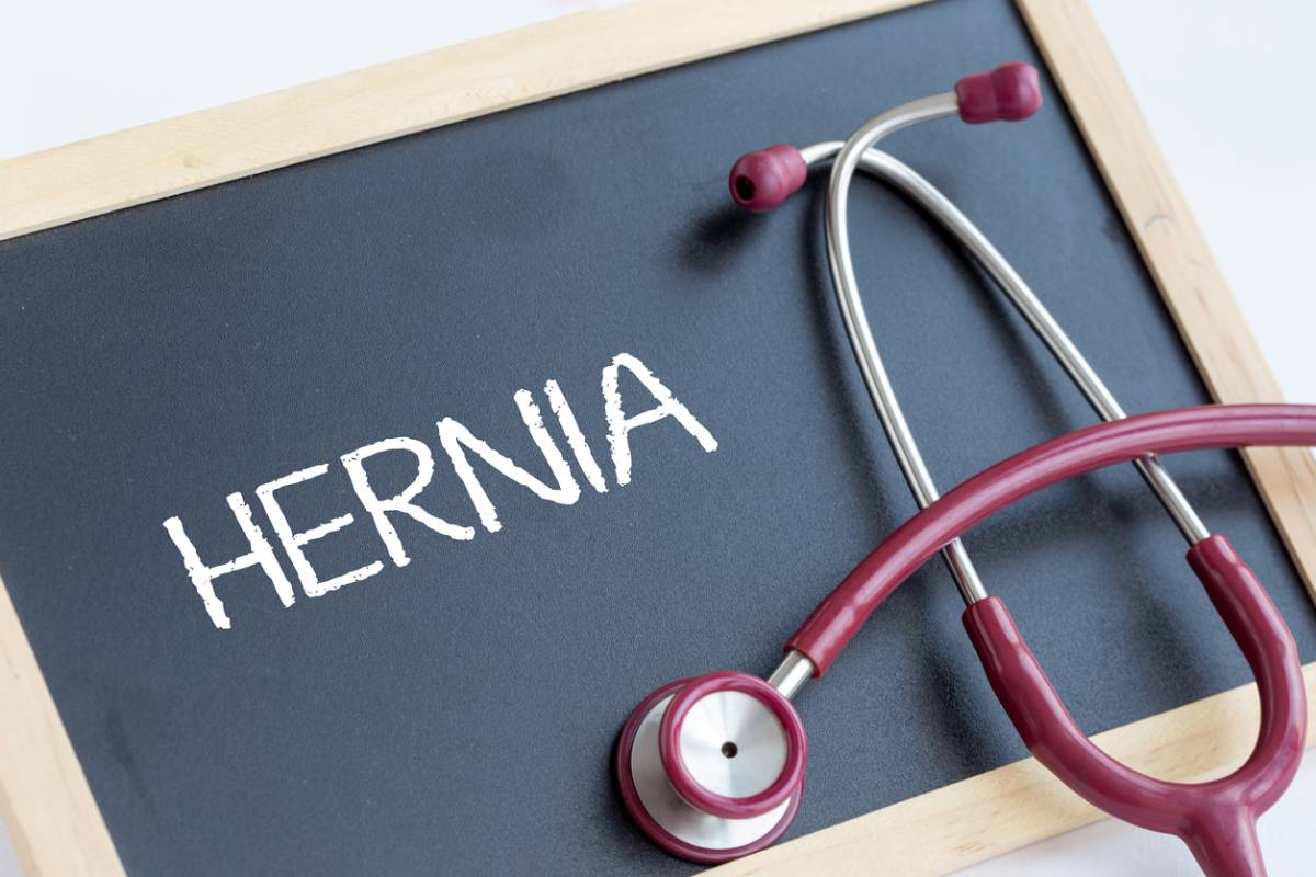 the word "Hernia" written on a board next to stethoscope.