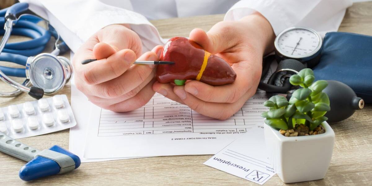 Doctor explaining what alcohol does to the liver.